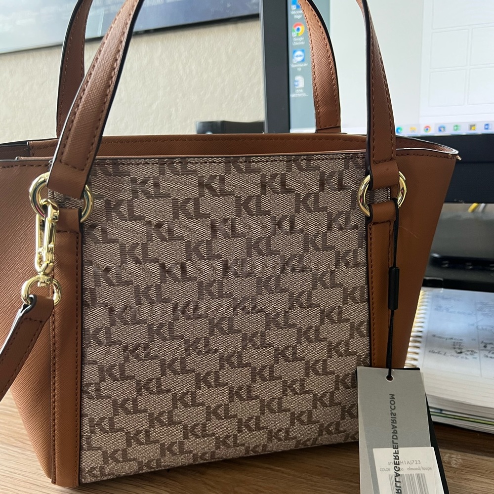 Brand new Karl Lagerfield Crissbody Bag. Strap drop: 23”. Hardware: gold metal